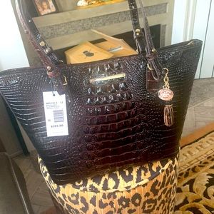 Never worn one time.  I have too many handbags.